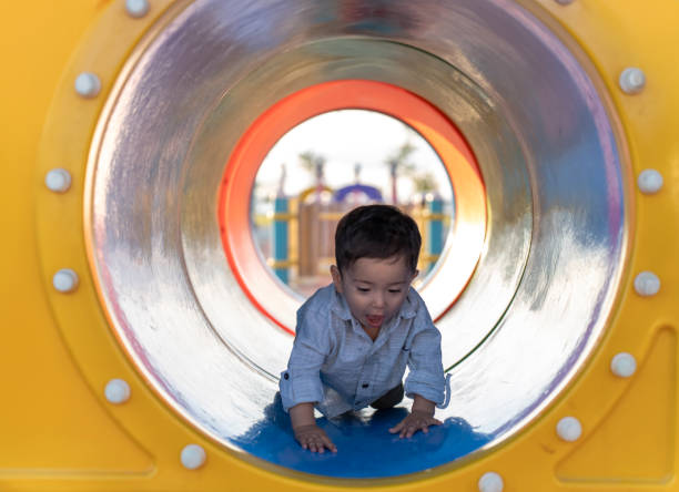 istock Boy having fun on the playground. 1535094447