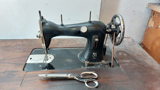 beautiful old sewing machine on the table