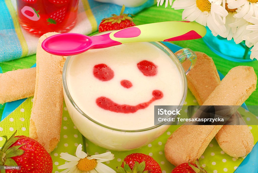 semolina dessert for baby semolina porridge with strawberry sauce  and lady fingers cookies as dessert for baby Baby Food Stock Photo