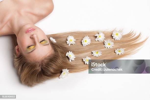 Attractive Young Woman Lying Covered With Flowers Stock Photo - Download Image Now - Adult, Beautiful People, Beautiful Woman