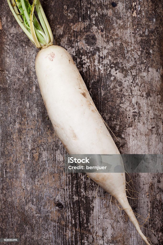 radish single radish on a wooden plank Agriculture Stock Photo