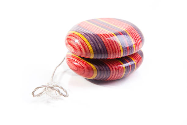 istock Mult-colored wooden yoyo isolated on white 153510566