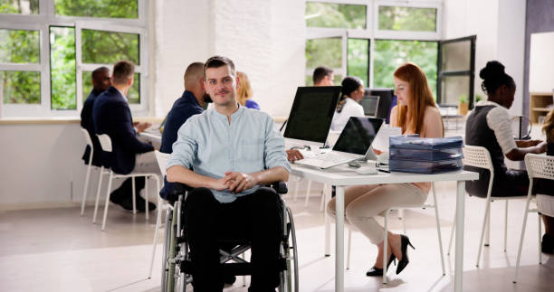 istock Business People With Disability In Office Workplace 1535131016