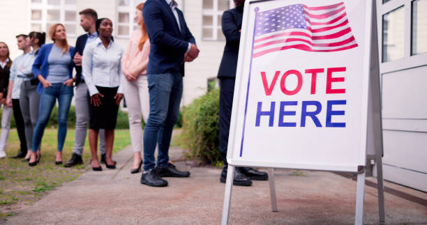 Diverse People At Voting Booth stock photo