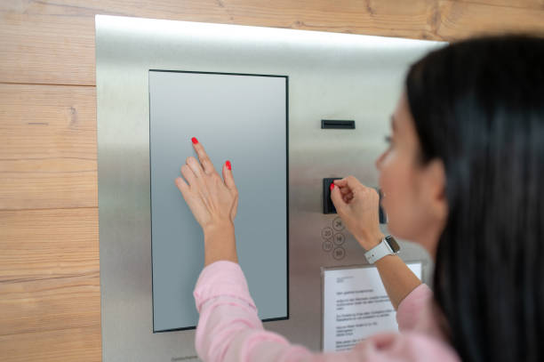 istock Woman buying coffee from automatic vending machine. 1535135802