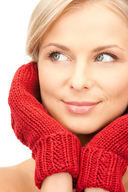istock beautiful woman in red mittens 153515176