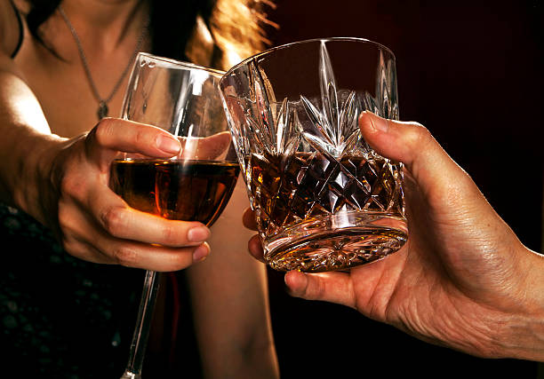 istock Male and Female Toasting with Alcoholic Drinks 153515317