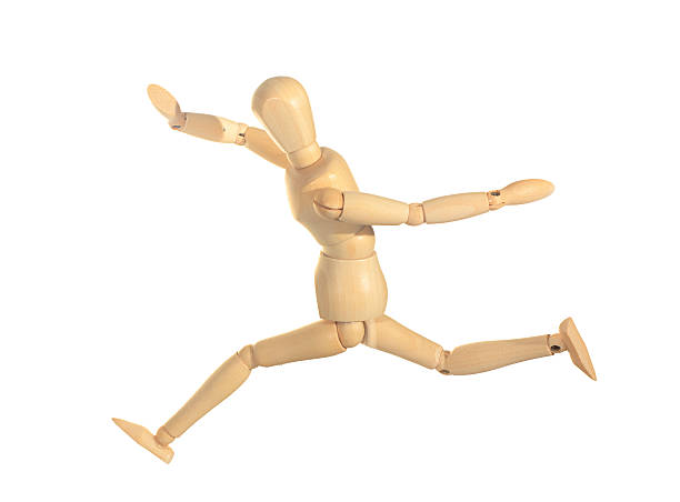 istock Yellow wooden dummy in run and jump action isolated 153515321