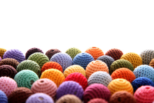 Side view of bulk of colorful cotton handmade crochet beads