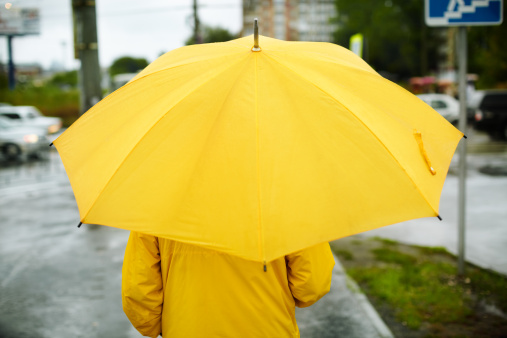 man with yellow umbrella ,selective focus