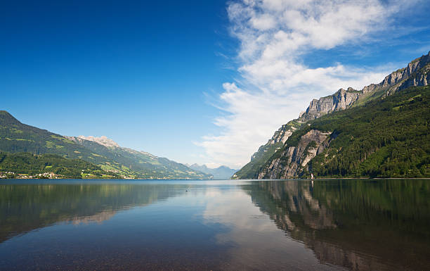 Lake and mountains under blue sky. Walensee, Switzerland. stock photo