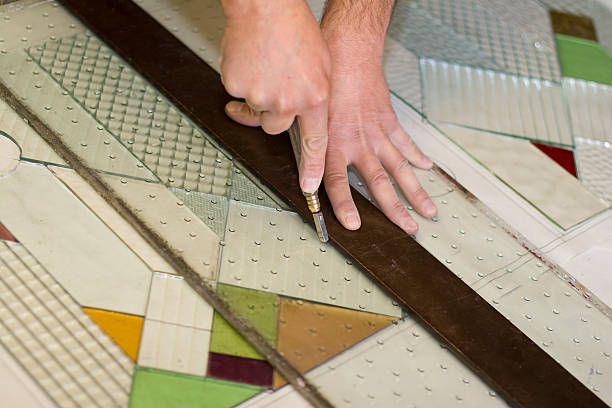 istock Craftsman Creating Victorian Stained Glass Panels 153518012