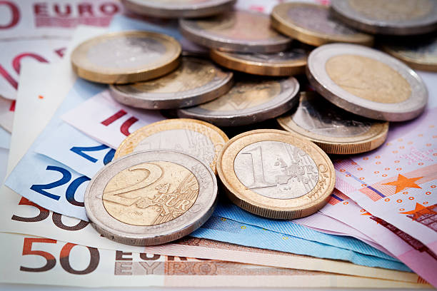 istock Euro banknotes and coins 153518105