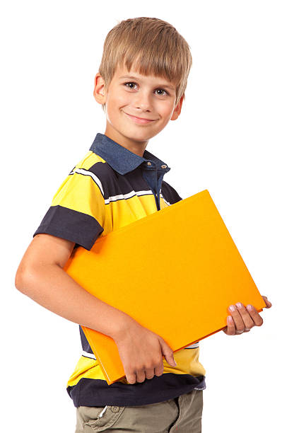 istock School boy is holding a book 153518386
