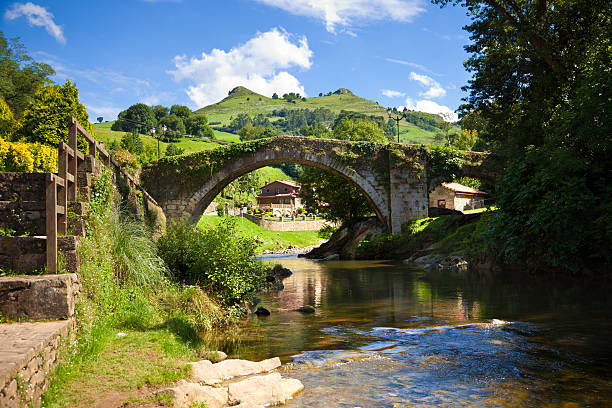 Medieval bridge and Miera River in Spain in the province of Santander, Cantabria, Spain cantabria stock pictures, royalty-free photos & images