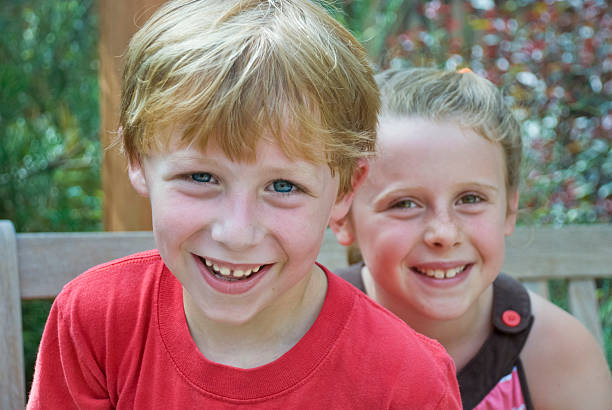 istock Boy and girl smiling 153521094
