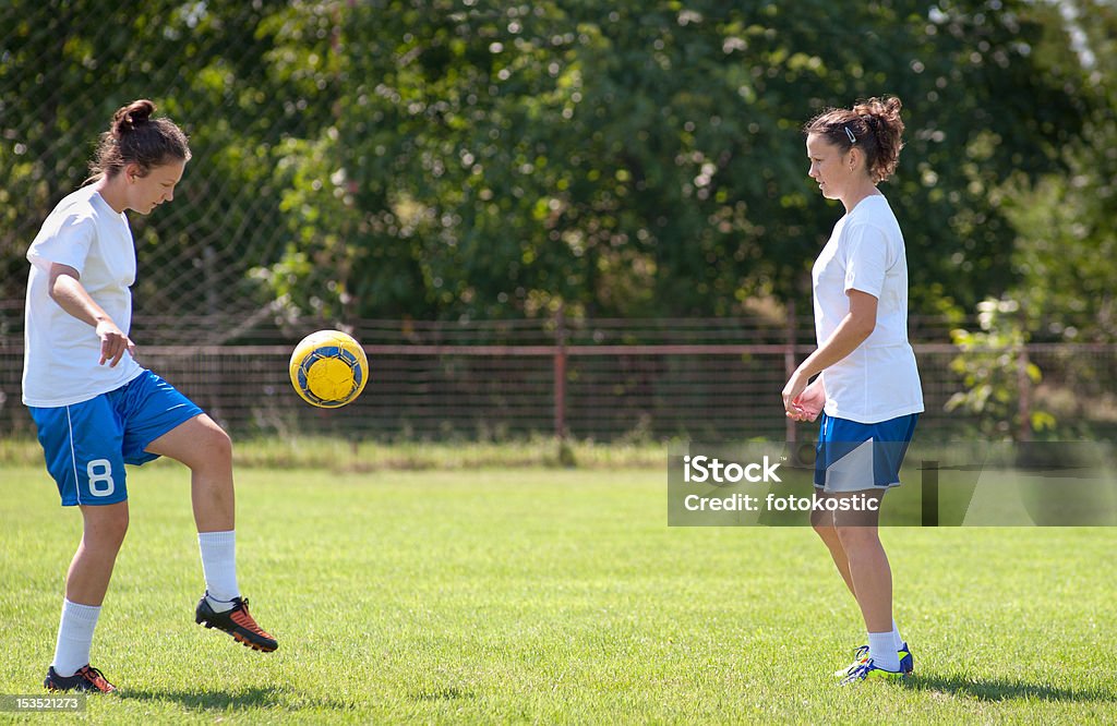 girls soccer Two young girls playing soccer 16-17 Years Stock Photo