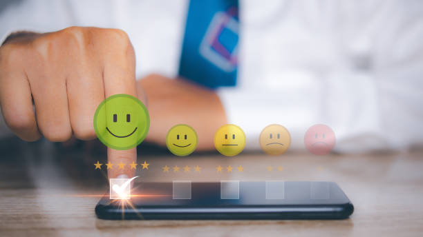 istock Man using smart phone choosing happy smile face positive mindset selection for feedback review satisfaction service. rating very impressed. Best quality. Customer satisfaction experience concept. 1535220637