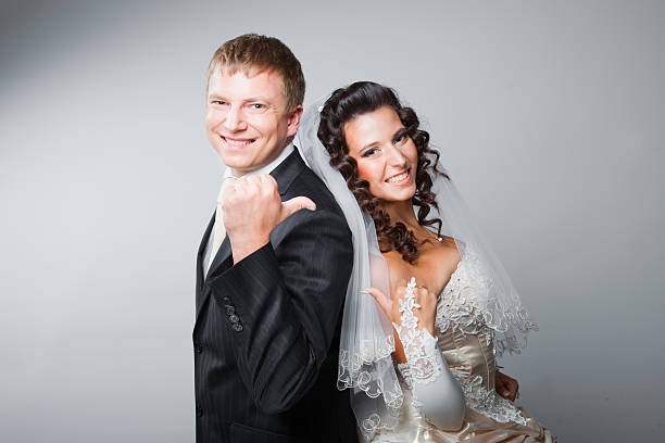 Gesticulating bride and groom stock photo