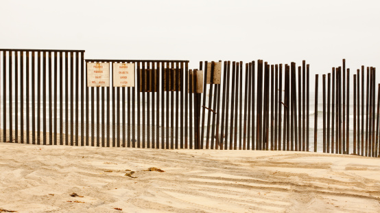 A shot of the U.S./Mexico fence going into the ocean.