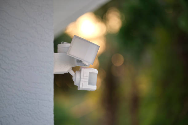 istock Motion sensor with light detector mounted on exterior wall of private house as part of security system 1535250079