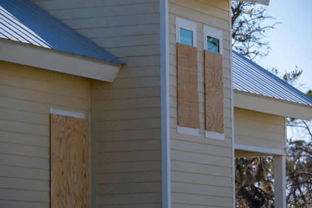 Plywood storm shutters for hurricane protection of house windows. Protective measures before natural disaster in Florida Plywood storm shutters for hurricane protection of house windows. Protective measures before natural disaster in Florida. boarded up stock pictures, royalty-free photos & images