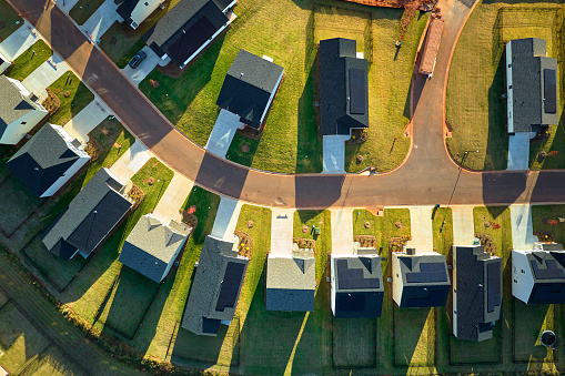 Aerial view of tightly located new family houses in South Carolina suburban area. Real estate development in american suburbs