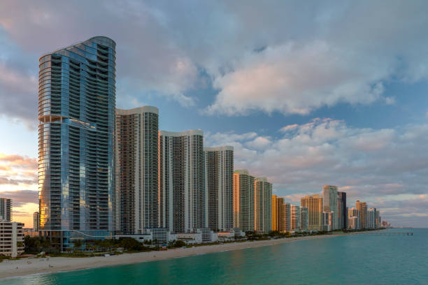 istock Expensive highrise hotels and condos over sandy beachfront on Atlantic ocean shore in Sunny Isles Beach city at sunset. American tourism infrastructure in southern Florida 1535250643