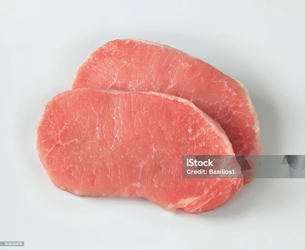 raw dois filés de carne suína isolado no fundo branco - Foto de stock de Carne de Porco royalty-free