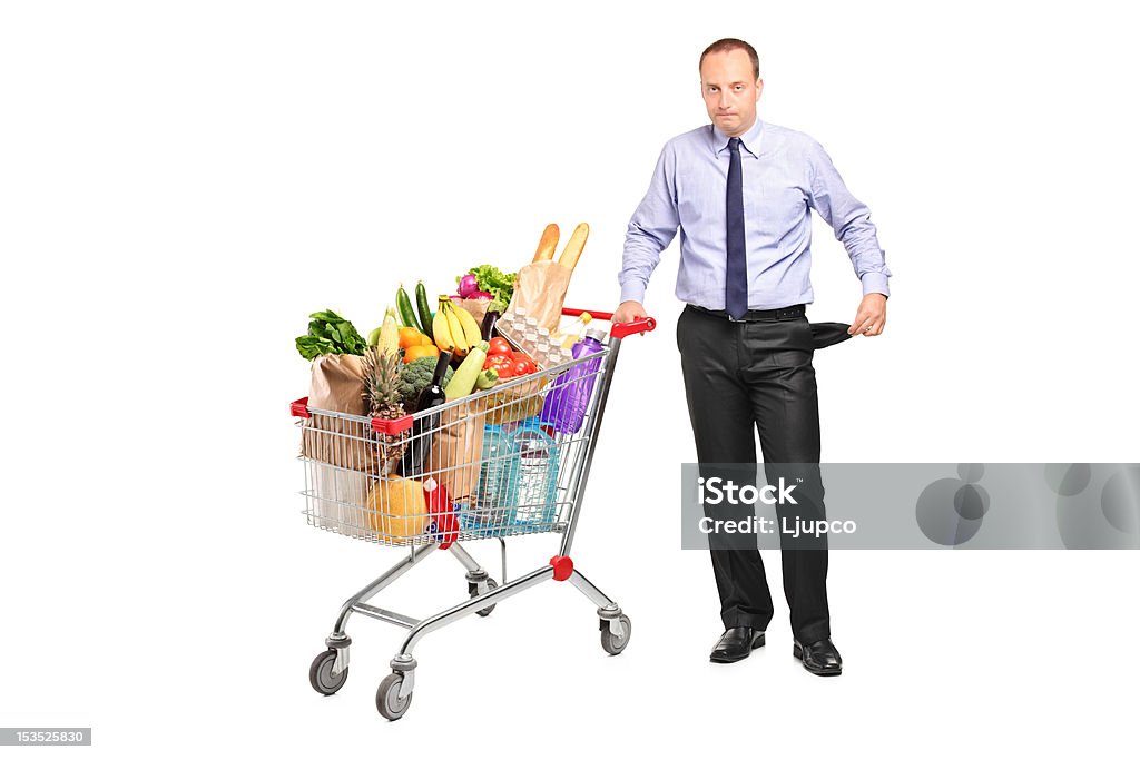 Bancarotta uomo che tiene un carrello acquisti - Foto stock royalty-free di Delusione