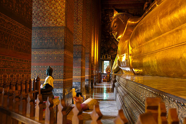 istock Reclining buddha within the Wat Pho in Bangkok Thailand. 153525850