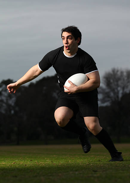 istock Rugby Player runs with the ball 153525967