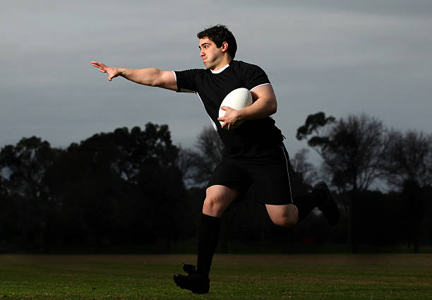 istock Rugby Player Runs with the Ball 153525971