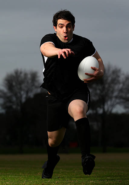 istock Rugby Player runs with the Ball 153525973