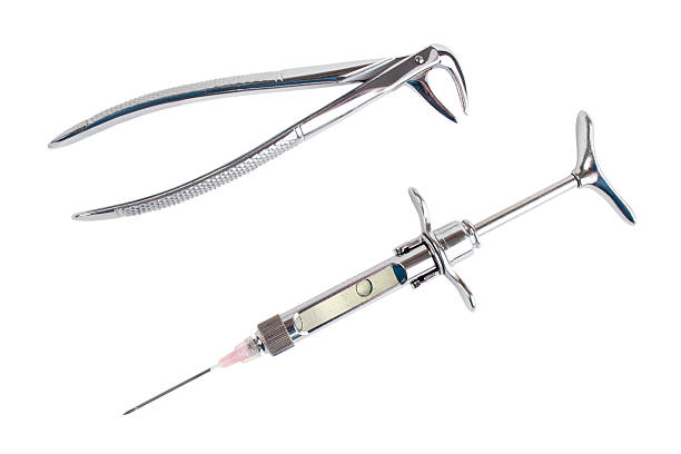 istock Dental forceps and syringe 153526158