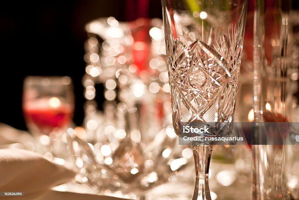 Festive Table Setting A festive dinner table setting complete with crystal stemware and candles Crystal Glassware Stock Photo