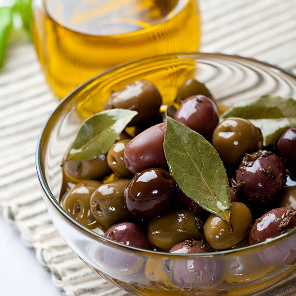 istock Marinated olives in a glass bowl 153526410