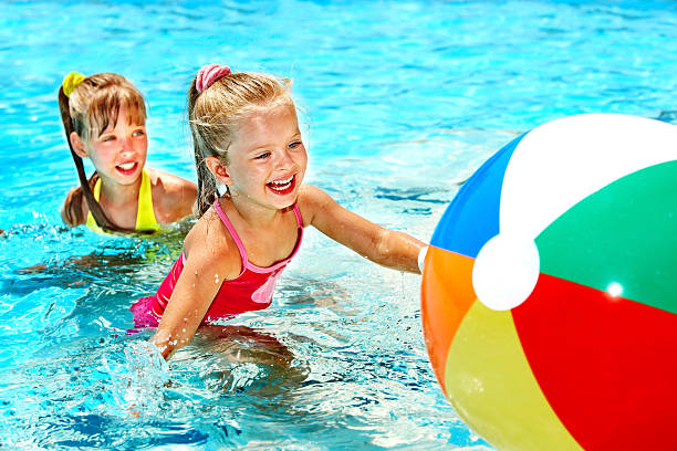 istock Children swimming in pool. 153527499