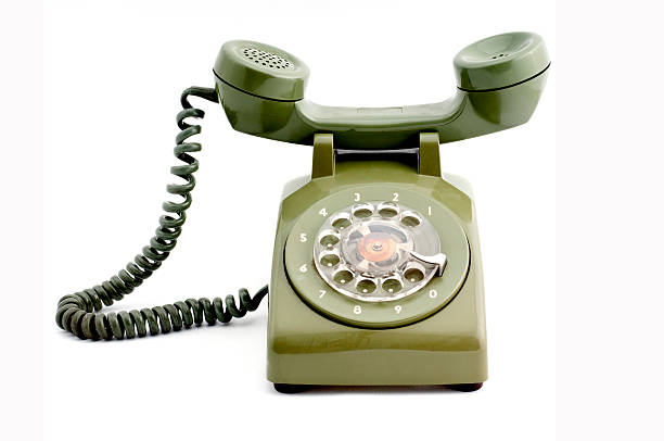 istock Old fashioned green telephone on white background. 153528634