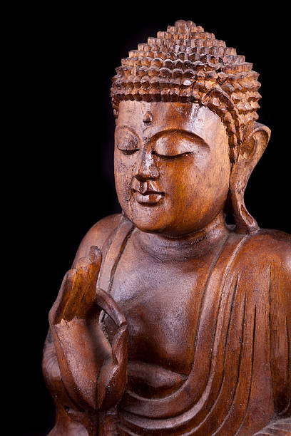 istock Wooden Buddha on black background 153528795