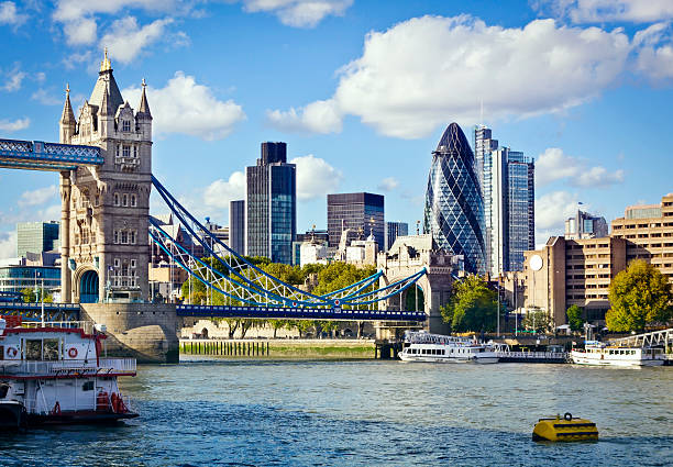 London skyline seen from the River Thames Financial District of London and the Tower Bridge lloyds of london photos stock pictures, royalty-free photos & images