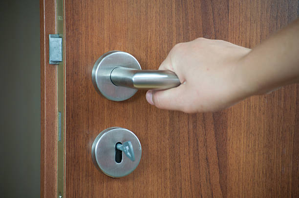 istock hand opening the door 153529719