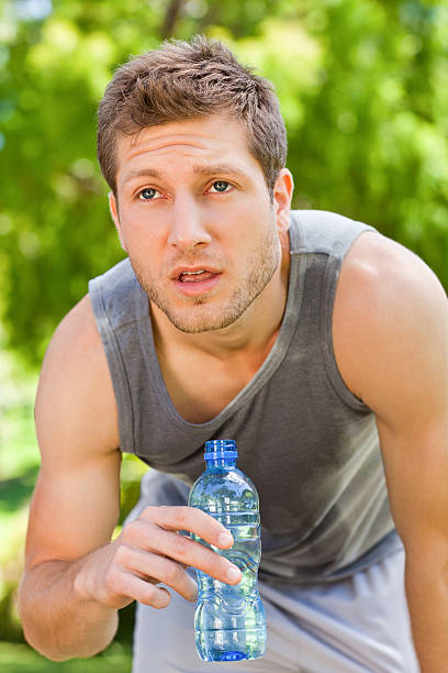 istock Sporty man drinking water 153530031