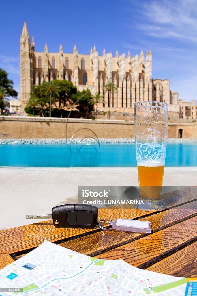 Car rental keys on table with city tourist map Palma Car rental keys on wood table with city tourist map in Palma de Mallorca cathedral Majorca Stock Photo