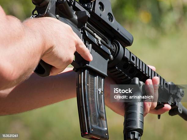 A Man Target Shooting At A Gun Range Stock Photo - Download Image Now - AR-15, Target Shooting, Black Color