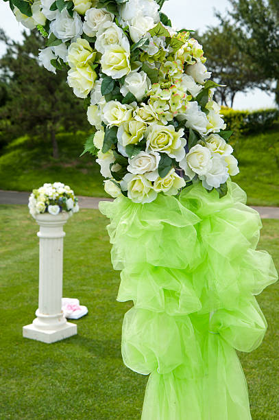 Flowers decorations at an outdoor wedding venue stock photo