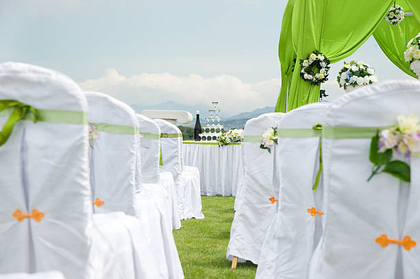 Row of decorated chairs on a outdoor wedding stock photo