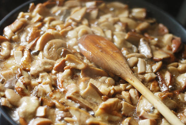 istock delicious fried mushrooms in a skillet 153531919