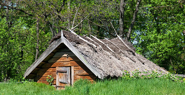 istock Old house with dried straw roof 153532274