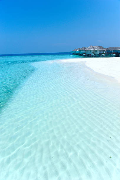 istock Maldives water villa and white beach 153532362